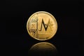 Gold MC COIN on a black background, cryptocurrency