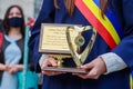 Gold medal in the hands of a graduate at the graduation day. Balti, Moldova May 31, 2021. Editorial use only