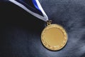 Gold medal on velvet cushion. Olympic games Royalty Free Stock Photo