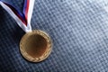 Gold medal on velvet cushion. Olympic games Royalty Free Stock Photo