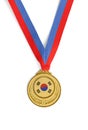 Gold medal on white as a symbol of victory in sports competition in South Korea Royalty Free Stock Photo