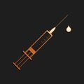 Gold Medical syringe with needle and drop icon isolated on black background. Syringe sign for vaccine, vaccination