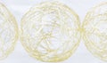 Gold meshed wire Christmas balls on white background. Royalty Free Stock Photo