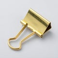 Gold Metal Binder Clip on White Background Royalty Free Stock Photo