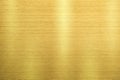 Gold metal texture of brushed stainless steel plate with the reflection of light Royalty Free Stock Photo