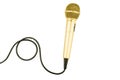 Gold microphone with cable on isolated white Royalty Free Stock Photo