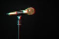 Gold microphone on stage on a black background. Digital signal glitch effect rgb shift, slices. Screen error