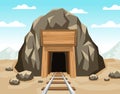 Gold mine entrance with rails in the rock Royalty Free Stock Photo