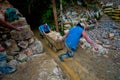 Small Scale Gold Miners Pulling Out Cart from pocket mines