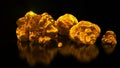 Gold mining. Native gold. Golden nuggets on black background. Business animation