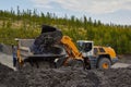 Gold mining in Susuman. The auto-loader loads a career dump-body truck. The Magadan area. Kolyma IMG_1006