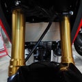 gold motorbike front shock and disc brake system Royalty Free Stock Photo