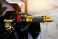 Gold motorcycle handle on street background Royalty Free Stock Photo