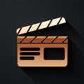 Gold Movie clapper icon isolated on black background. Film clapper board. Clapperboard sign. Cinema production or media