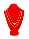 Gold necklace on necklace display stand isolated on white background, Save Clipping path Royalty Free Stock Photo