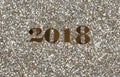 2018 gold New Year numbers on bright glitter background