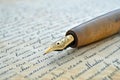 Gold-nibbed fountain pen on handwritten letter, suitable for historical documentaries or educational settings Royalty Free Stock Photo