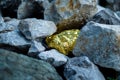 Gold nugget and grey granite stone