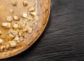 Gold nuggets on brass plate top view. Imitation of gold nuggets Royalty Free Stock Photo