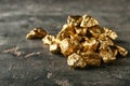 Gold nuggets on dark background Royalty Free Stock Photo