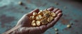 Gold Nuggets in Hand Near Industrial Background Royalty Free Stock Photo