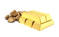 Gold nuggets and ingots on white Royalty Free Stock Photo