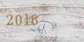 2018 gold numbers on rustic white wooden boards