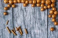 Gold nuts and gilt sticks on the background of old wooden panels, Christmas background