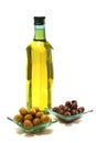 Gold olive oil in buttle over white