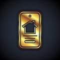 Gold Online real estate house on smartphone icon isolated on black background. Home loan concept, rent, buy, buying a Royalty Free Stock Photo