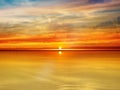 Gold orange sunset dramatic cloudy sky lilac pink sea water reflection sunlight evening summer seascape landscape ,night dramaticb Royalty Free Stock Photo