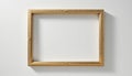 Gold ornate frame empty, displayed on white surface, classic art presentation. Royalty Free Stock Photo