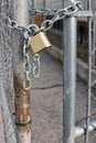 Gold Padlock on Chainlink Fence