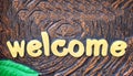 Gold paint alphabet welcome sign patterns abstract on background