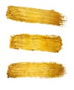 Gold paint brush stroke isolated on white