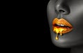 Gold Paint smudges drips from African American woman face, lips lipgloss dripping from sexy lips, golden liquid drops Royalty Free Stock Photo