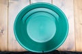 Gold pan. Green plate for finding nuggets or flakes of gold Royalty Free Stock Photo