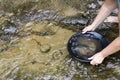 Gold panning for gold Royalty Free Stock Photo