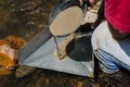 Gold panning with sluice box Royalty Free Stock Photo