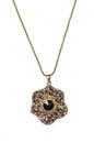 Gold pendant with a black gems on a white background