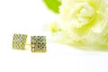 Gold pendant cameo earring jewelry in square diamond shape isolated on white