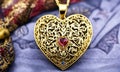 gold pendant in the shape of a heart. Selective focus. Royalty Free Stock Photo
