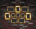 Gold photo frames on a brick wall background Royalty Free Stock Photo