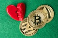 Gold physical Bitcoin, Litecoin and Ethereum coins with broken heart