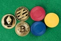 Gold physical Bitcoin, Litecoin and Ethereum coins with casino chips