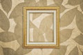 Gold Picture Frame on Brown Leaves Pattern