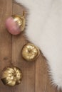 Gold and pink colored pumpkins on wooden floor