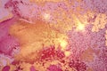 Gold, pink and magenta abstract marble background with sparkles