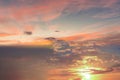 Gold pink sunset fluffy white clouds on  blue sky background Royalty Free Stock Photo