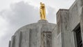 Gold pioneer statue atop the Oregon State Capitol Building Royalty Free Stock Photo